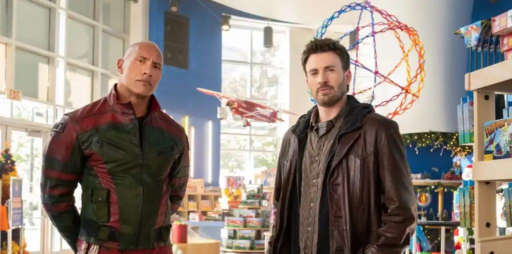 Dwayne Johnson & Chris Evans’ ‘Red One’ From  Seven Bucks & Amazon MGM To Jingle In Theaters Next Year